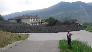 Mudslide barrels through Swiss town [upl. by Romalda]