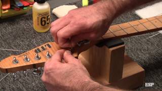 ESP Guitars Restringing a guitar with a Floyd Rose [upl. by Anitsahs740]